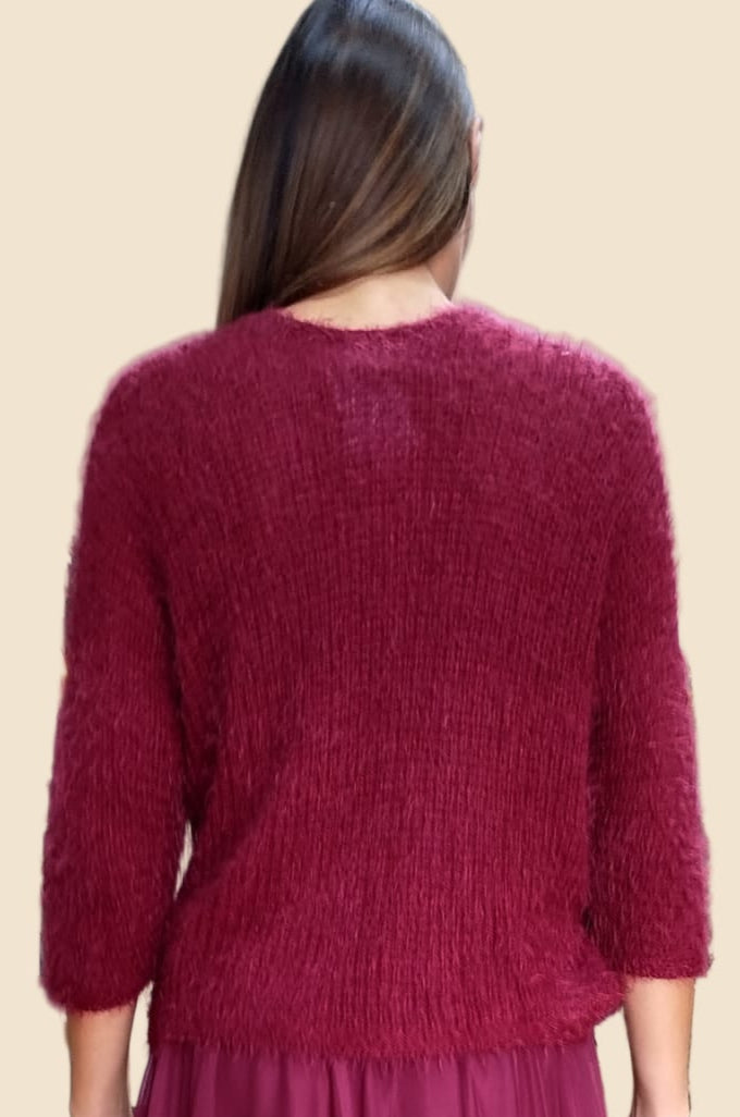 Cardigan corto con spilla